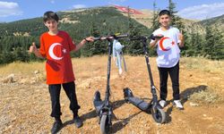 SCOOTERCULAR ZİRVEDE DÜNYANIN EN BÜYÜK BAYRAĞI İLE BULUŞTULAR